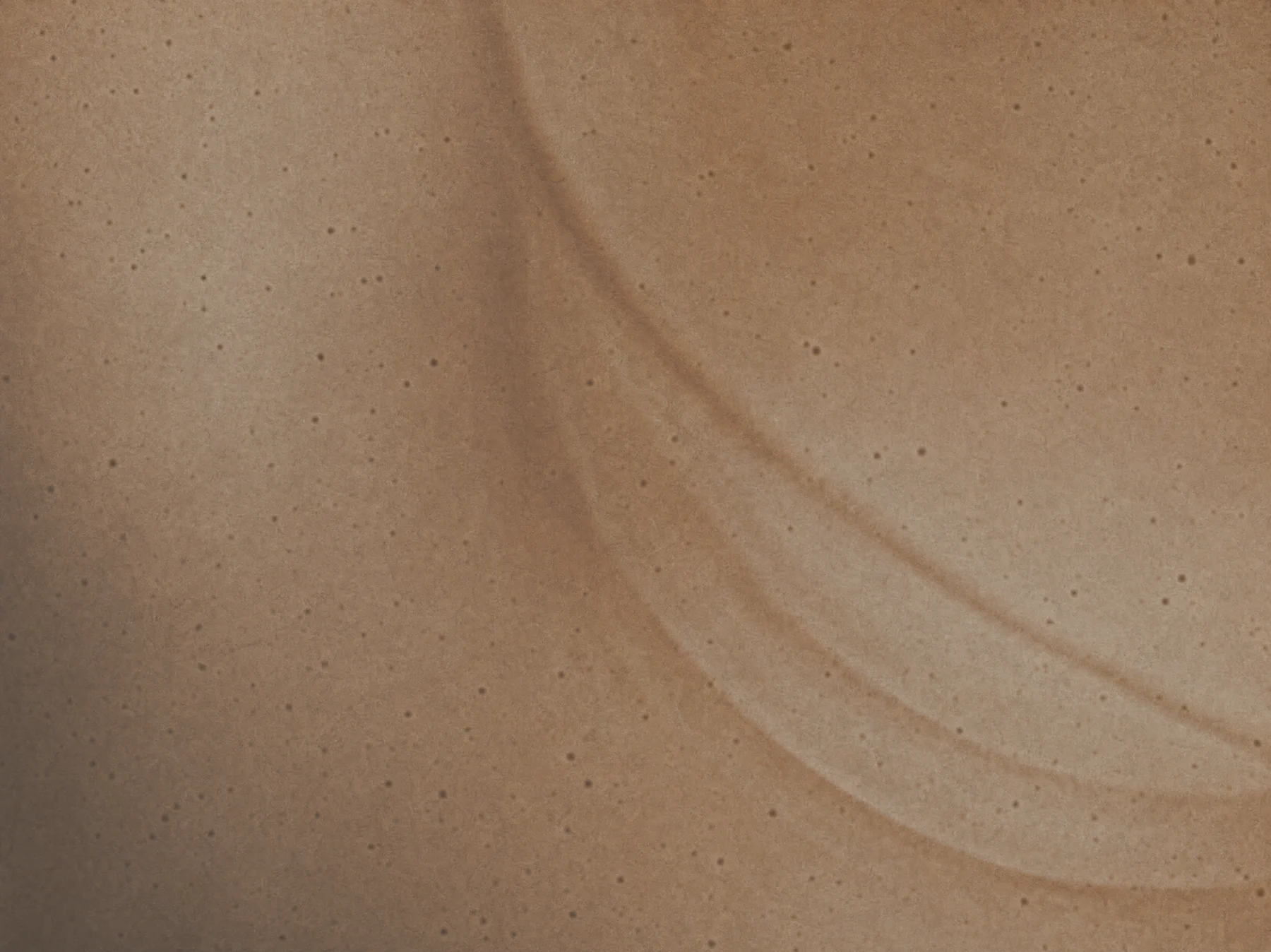A precise sandstone arc embedded in a tactile material field